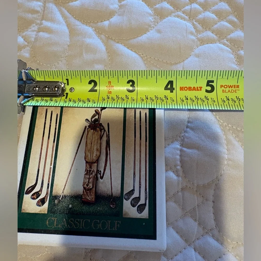 Vintage ceramic coasters depicting classic golf clubs.